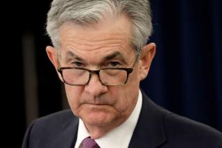 FILE PHOTO: Federal Reserve Board Chairman Jerome Powell listens to questions at his news conference following the closed two-day Federal Open Market Committee meeting in Washington, U.S., May 1, 2019. REUTERS/Yuri Gripas/File Photo